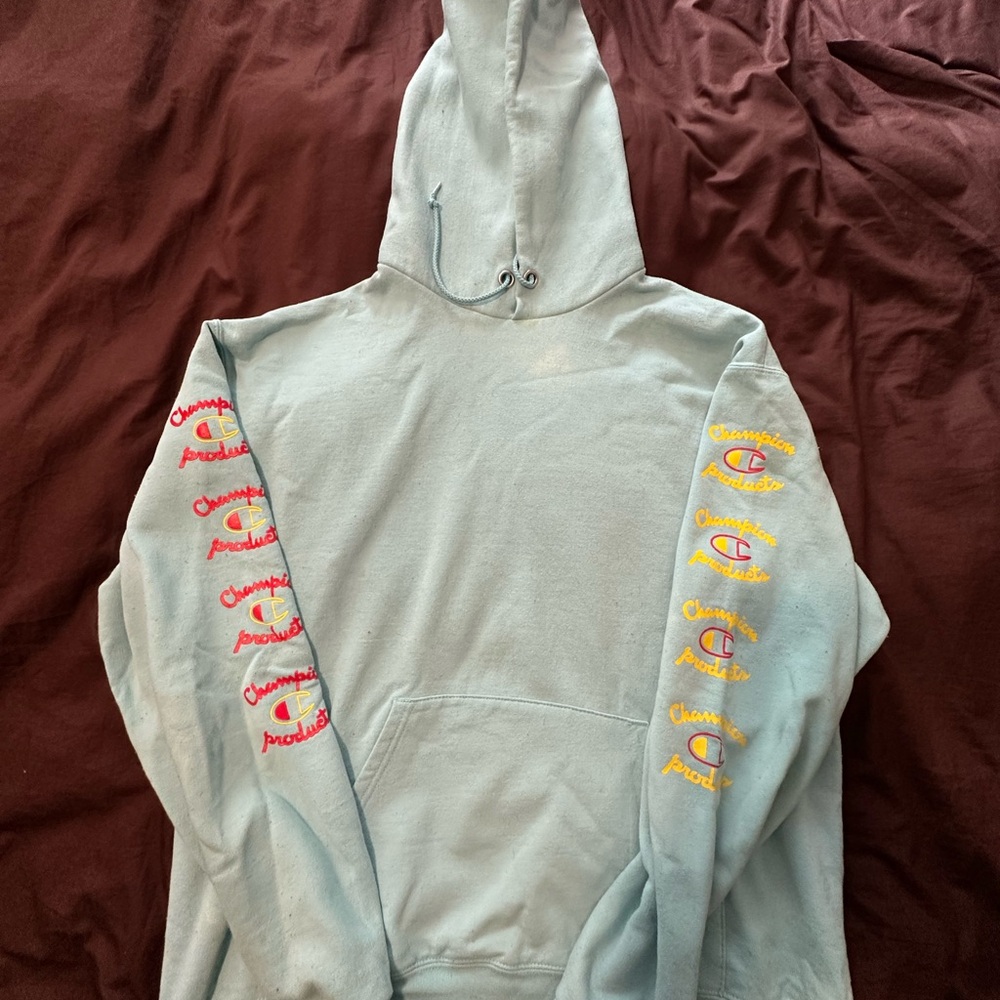 Champion Light Blue Hoodie with Red and Yellow Accents